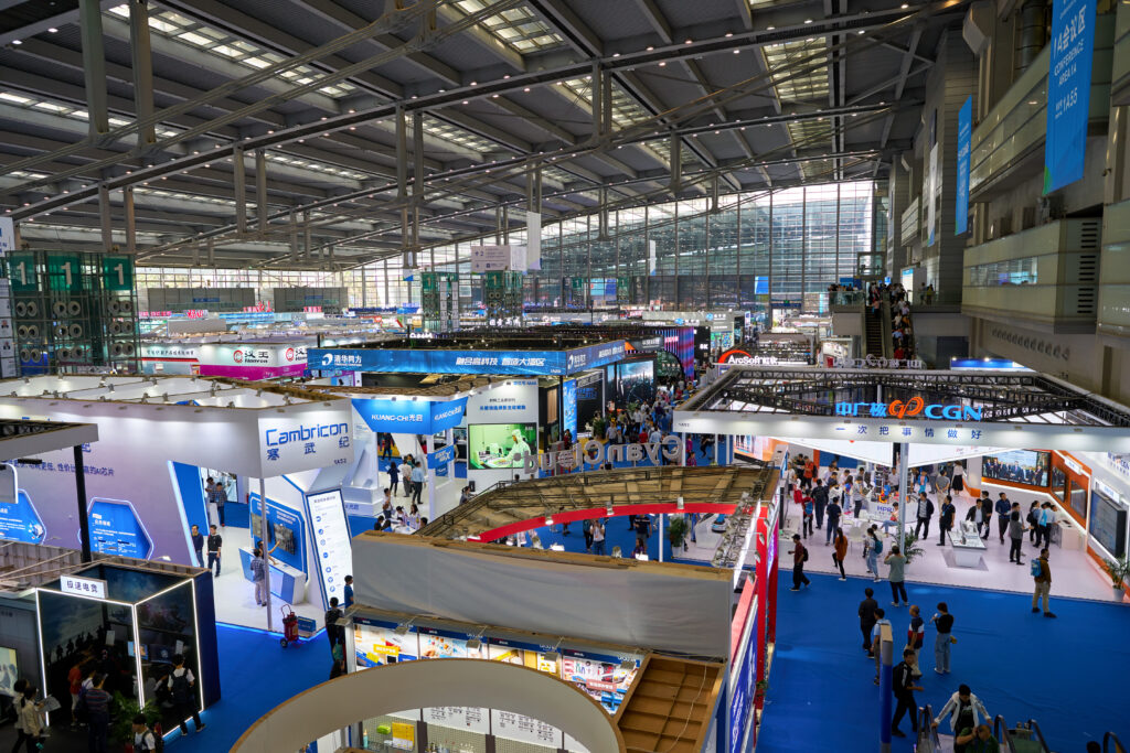 shenzhen, china circa november, 2019: top view of exhibition stands and people at china hi tech fair 2019 at shenzhen convention & exhibition center.